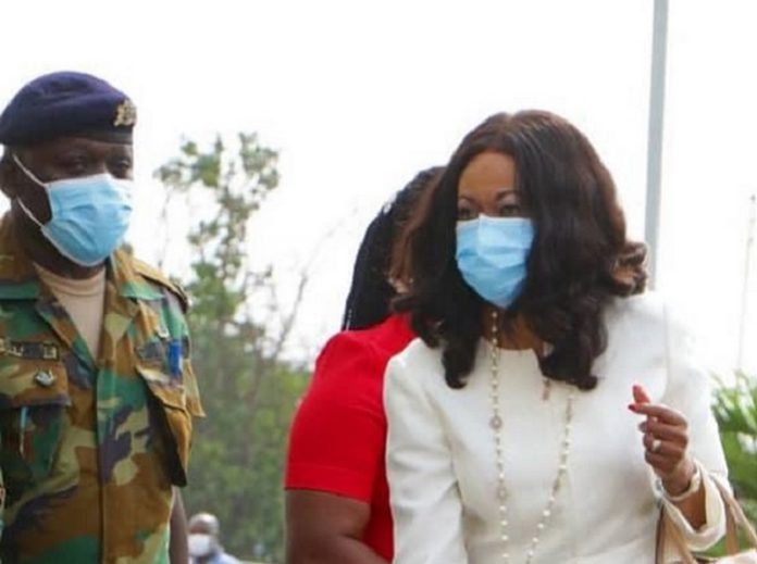Jean Mensa Jean Mensa is being protected by a military officer