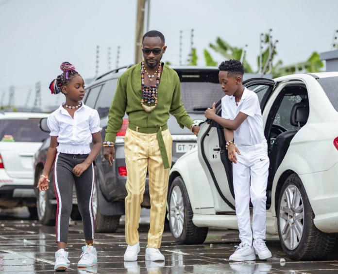 Okyeame Kwame and his two children