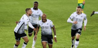Andre Ayew celebrates with Swansea City teammates