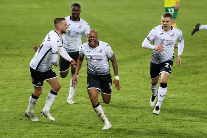 Andre Ayew celebrates with Swansea City teammates Andre Ayew celebrates with Swansea City teammates