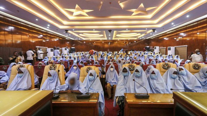 The girls gathered at a state government building following their release The girls gathered at a state government building following their release