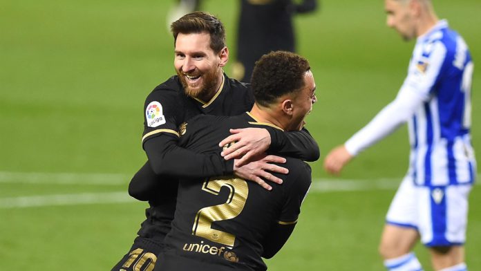 Barcelona's Barcelona's US defender Sergino Dest celebrates with Barcelona's Argentinian forward Lionel Messi (back) after scoring a goal during the Spanish League football match between Real Sociedad and Barcelona Image credit: Getty Images Barcelona's Barcelona's US defender Sergino Dest celebrates with Barcelona's Argentinian forward Lionel Messi (back) after scoring a goal during the Spanish League football match between Real Sociedad and Barcelona Image credit: Getty Images