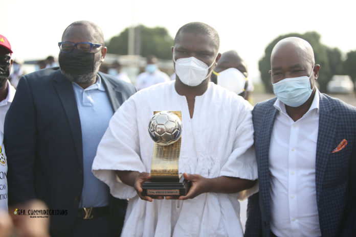 Sports Minister with U-20 Afcon trophy Sports Minister with U-20 Afcon trophy