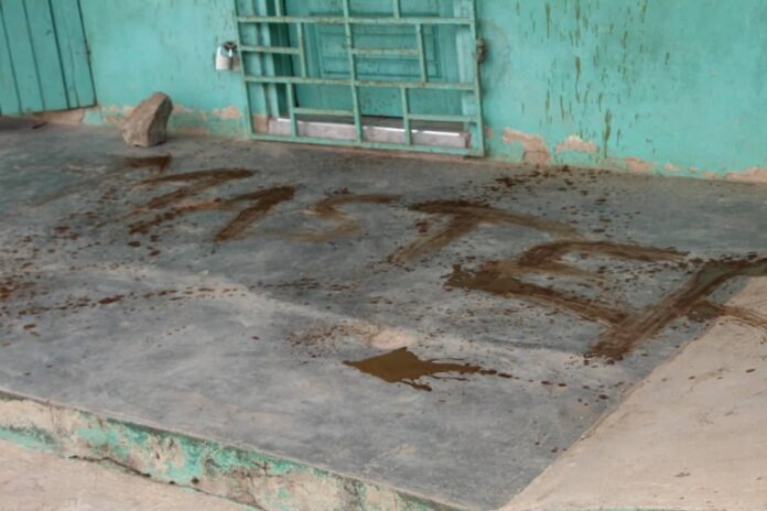 King of Glory Presbyterian Basic School painted with feces