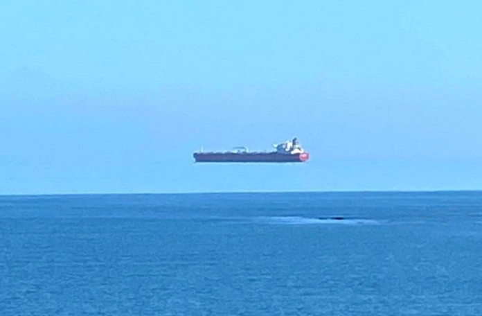 An optical illusion caused the ship to appear as though it was hovering above the horizon / DAVID MORRIS/APEX