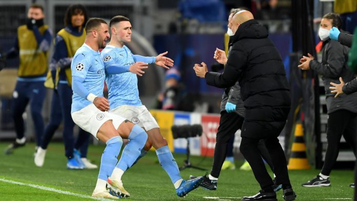 Phil Foden esulta abbracciando Pep Guardiola, Borussia Dortmund-Manchester City, Getty Images Image credit: Getty Images Phil Foden esulta abbracciando Pep Guardiola, Borussia Dortmund-Manchester City, Getty Images Image credit: Getty Images