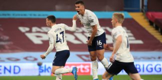 Phil Foden of Manchester City celebrates with Rodrigo after scoring their side's first goal during the Premier League match between Aston Villa and Manchester City at Villa Park on April 21, 2021 in Birmingham, England. Image credit: Getty Images