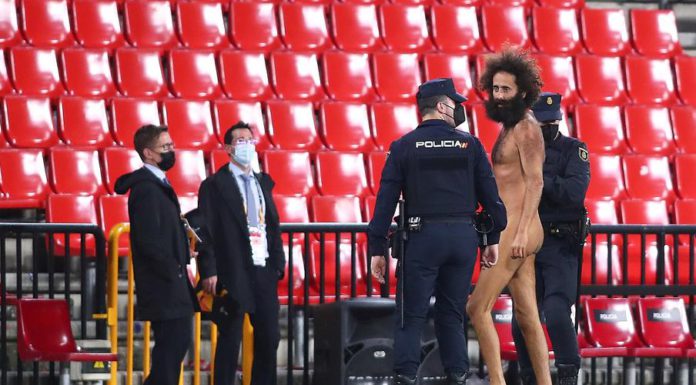 A streaker is being apprehended by the police © Getty Images A streaker is being apprehended by the police © Getty Images