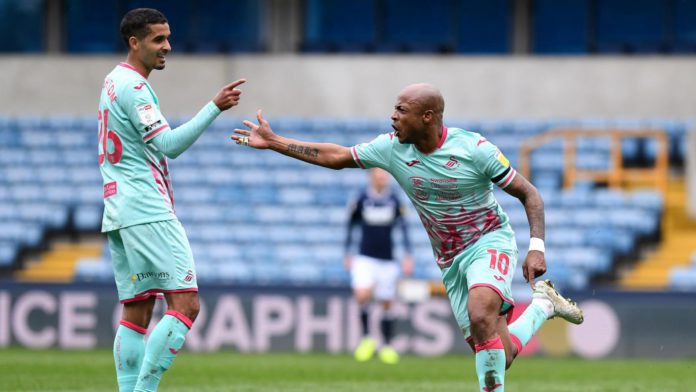Andre Ayew celebrates with Swansea City teammate Andre Ayew celebrates with Swansea City teammate
