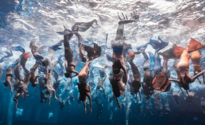 On April 28, 100 mermaids took to the waters of Atlantis Sanya's Ambassador Lagoon. Courtesy of Atlantis Sanya/PADI