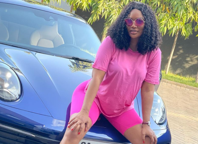 Sandra Ankobiah Sandra Ankobiah shows off blue Porsche 911 Carrera
