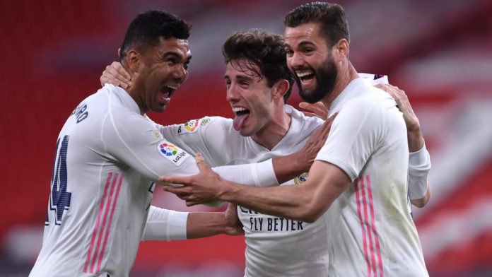 Nacho of Real Madrid celebrates with team mates (L - R) Casemiro and Alvaro Odriozola after scoring their side's first goal during the La Liga Santander match between Athletic Club and Real Madrid Image credit: Getty Images Nacho of Real Madrid celebrates with team mates (L - R) Casemiro and Alvaro Odriozola after scoring their side's first goal during the La Liga Santander match between Athletic Club and Real Madrid Image credit: Getty Images