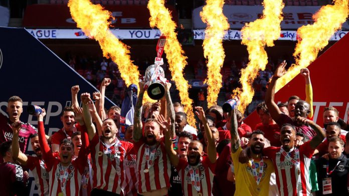 Pontus Jansson of Brentford lifts the Sky Bet Championship Play Off Trophy following victory in the Sky Bet Championship Play-off Final between Brentford FC and Swansea City at Wembley Stadium on May 29, 2021 in London, England. Image credit: Getty Images Pontus Jansson of Brentford lifts the Sky Bet Championship Play Off Trophy following victory in the Sky Bet Championship Play-off Final between Brentford FC and Swansea City at Wembley Stadium on May 29, 2021 in London, England. Image credit: Getty Images