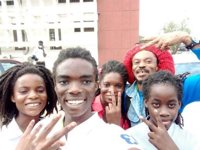 Tyrone Iras Marhguy with his triplet family, together with his father and a relative. Credit: @marhguy_tyrone Tyrone Iras Marhguy with his triplet family, together with his father and a relative. Credit: @marhguy_tyrone