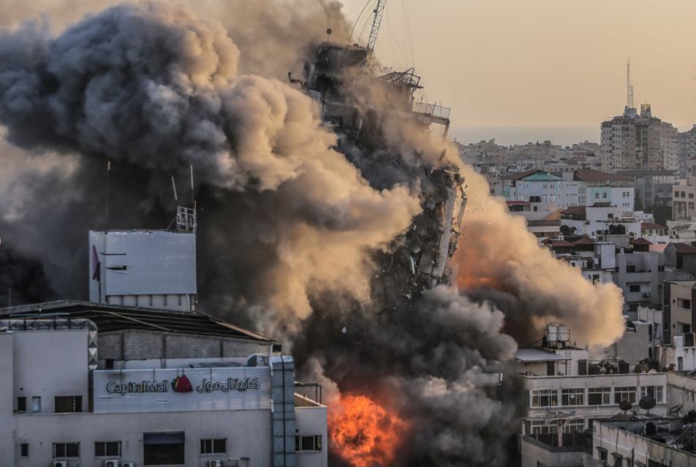 Smoke and flames rise after an Israeli strike on Al-Shorouq tower in Gaza City, on May 12, 2021.PHOTO: EPA-EFE