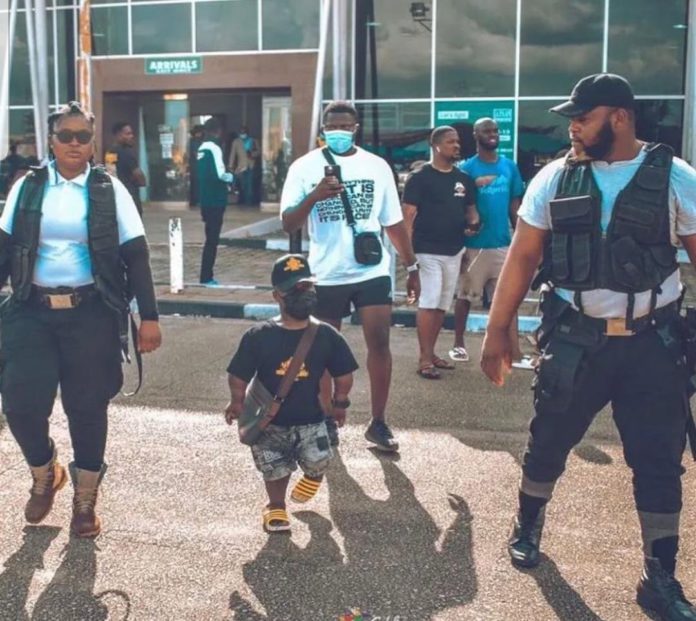 Shatta Bandle surrounded by armed men on arriving in Nigeria