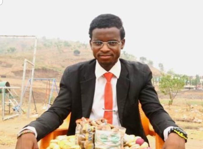 hawker who wears suit and tie to sell kola nut