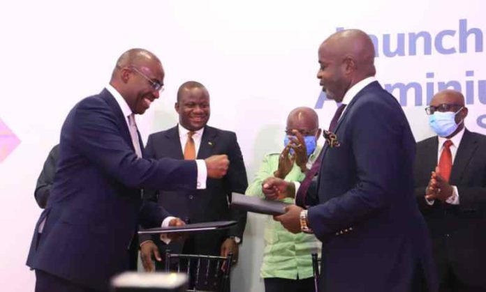 Mr. Michael Ansah, CEO of GIADEC and Mr Kwasi Osei Ofori CEO of Rocksure International after signing the Agreement with President Akufo-Addo looking on