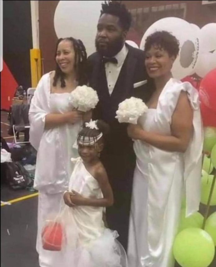 Dr. Umar Johnson with two wives