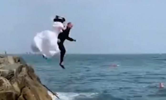 couple jump into sea
