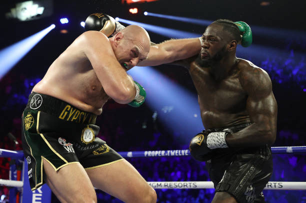 LAS VEGAS, NEVADA - FEBRUARY 22: Deontay Wilder punches Tyson Fury during their Heavyweight bout for Wilder's WBC and Fury's lineal heavyweight title on February 22, 2020 at MGM Grand Garden Arena in Las Vegas, Nevada. (Photo by Al Bello/Getty Images) LAS VEGAS, NEVADA - FEBRUARY 22: Deontay Wilder punches Tyson Fury during their Heavyweight bout for Wilder's WBC and Fury's lineal heavyweight title on February 22, 2020 at MGM Grand Garden Arena in Las Vegas, Nevada. (Photo by Al Bello/Getty Images)