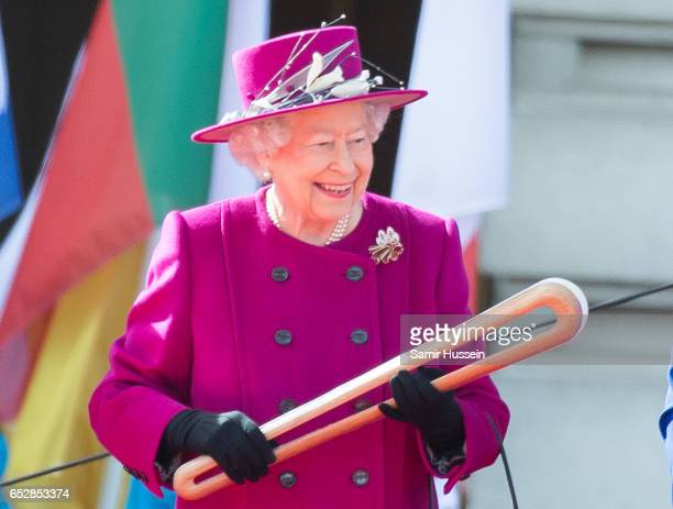 Queen’s Baton LONDON, ENGLAND - MARCH 13: Queen Elizabeth II holds the Commonwealth baton during the launch of The Queen's Baton Relay for the XXI Commonwealth Games being held on the Gold Coast in 2018 at Buckingham Palace on March 13, 2017 in London, England. (Photo by Samir Hussein/Samir Hussein/WireImage)