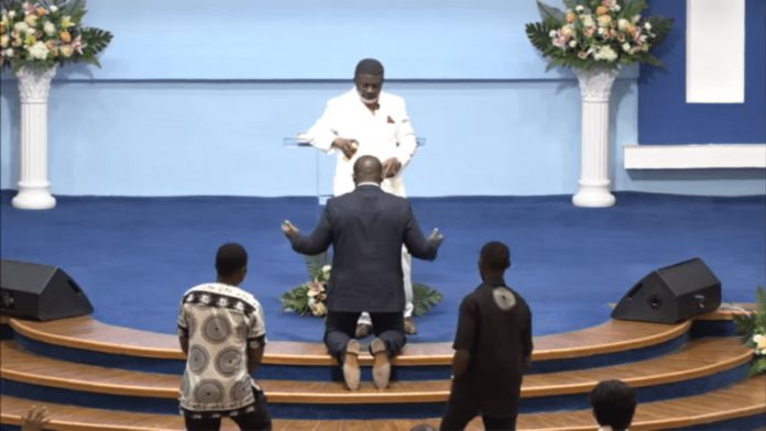 Bishop Charles Agyinasare anoints Sam George