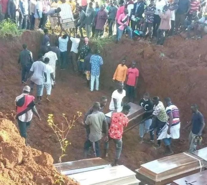 Woman mourns after 11 of her family members are murdered