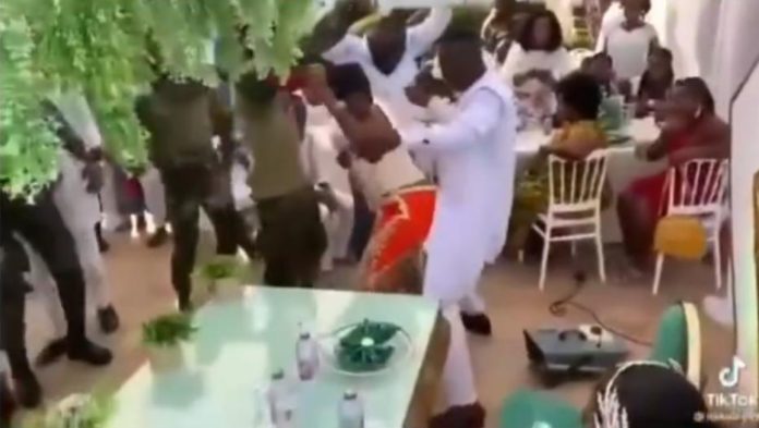 Groom dancing with female guest
