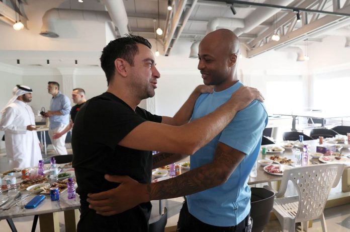 Andre Ayew with Xavi Andre Ayew with Xavi