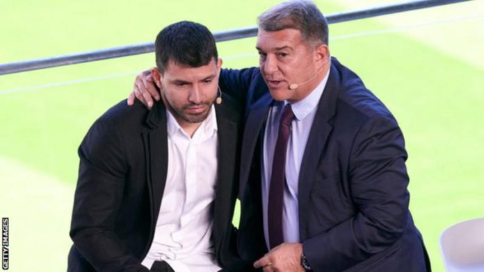Aguero was consoled by Barcelona president Joan Laporta during the news conference Aguero was consoled by Barcelona president Joan Laporta during the news conference