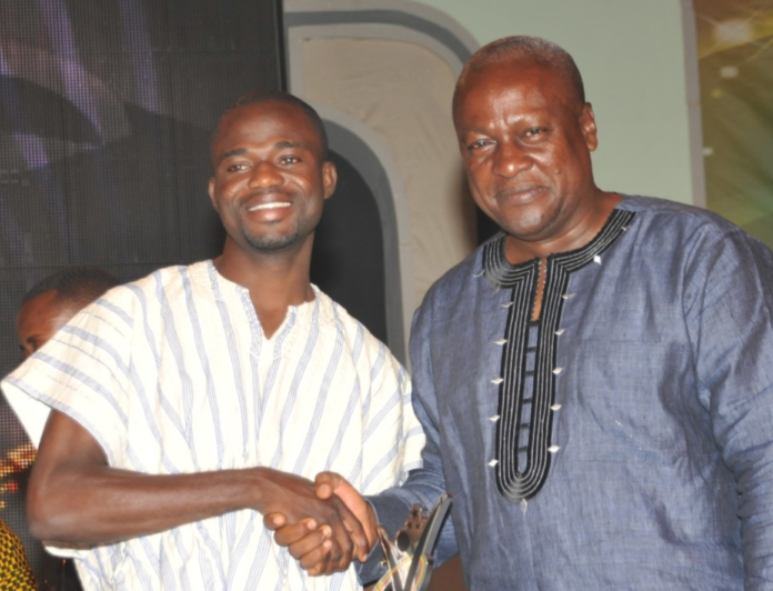 Former President John Mahama congratulates Manasseh at the National Youth Achievers Award