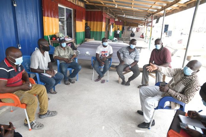 Coffinmakers_1600x1064 Mr Emmanuel K.E. Appoh (right), acting Director of Environmental Quality of the EPA, addressing the executive of the Korle Bu Coffin Makers Association. Picture: Emmanuel Quaye