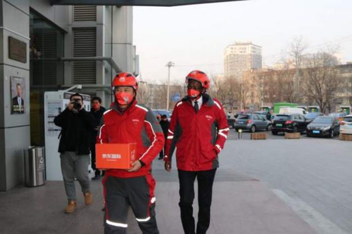 James-Kimonyo-rode-a-delivery-bike-to-an-online-customer-in-China (Copy)