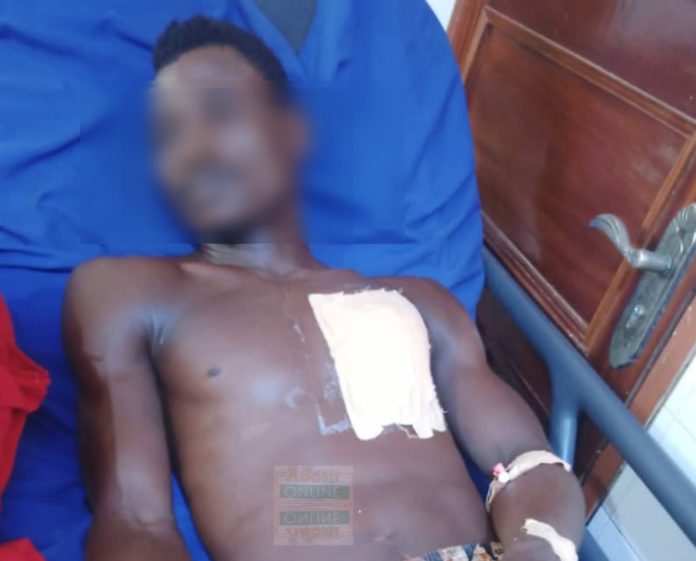 Charles Soglo receiving treatment at the hospital after attempted murder-suicide