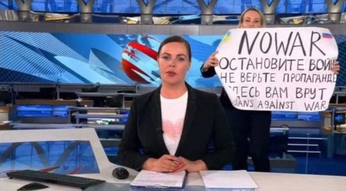 It comes after news editor Marina Ovsyannikova held up an anti-war message during a live broadcast last night ( Image: AFP via Getty Images) It comes after news editor Marina Ovsyannikova held up an anti-war message during a live broadcast last night ( Image: AFP via Getty Images)