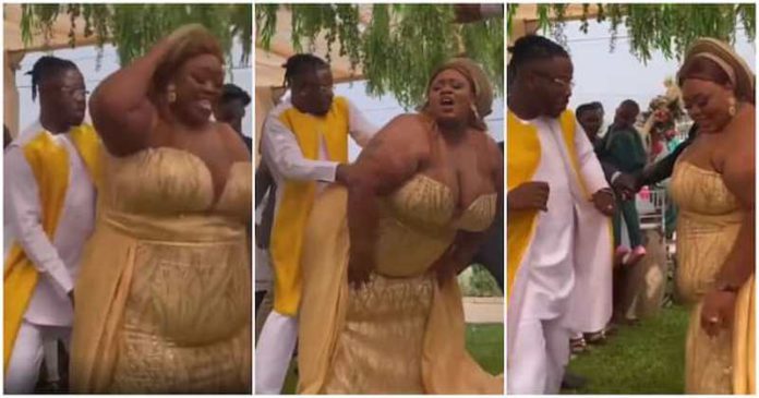 The bride and her groom have excited social media with their dance moves Photo source: @hiz_sarpomaah_official The bride and her groom have excited social media with their dance moves Photo source: @hiz_sarpomaah_official