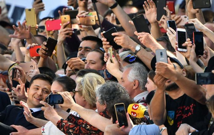 Supporters crowded around Mr. Zelensky as he arrived at parliament in Kyiv for a swearing-in ceremony in 2019. PHOTO: SERGEI SUPINSKY/AGENCE FRANCE-PRESSE/GETTY IMAGES Supporters crowded around Mr. Zelensky as he arrived at parliament in Kyiv for a swearing-in ceremony in 2019. PHOTO: SERGEI SUPINSKY/AGENCE FRANCE-PRESSE/GETTY IMAGES