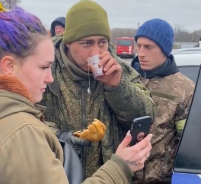 Ukrainian soldier being fed