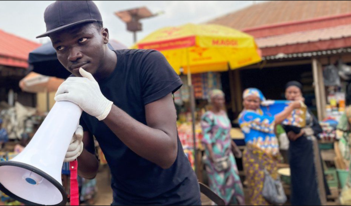 Onlookers gathered, then quickly dispersed when they heard Gbenga Adewoyin in the market