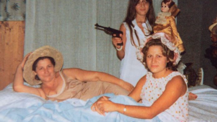 Marisa Merico holding her father's gun (Image: Daily Mirror/Andy Stenning) Marisa Merico holding her father's gun (Image: Daily Mirror/Andy Stenning)