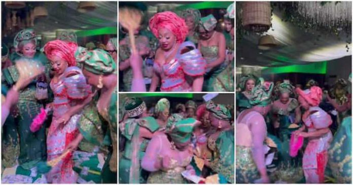 Nollywood actresses making it rain cash at Rita Dominic's wedding. Photos: @chiomaakpotha Nollywood actresses making it rain cash at Rita Dominic's wedding. Photos: @chiomaakpotha