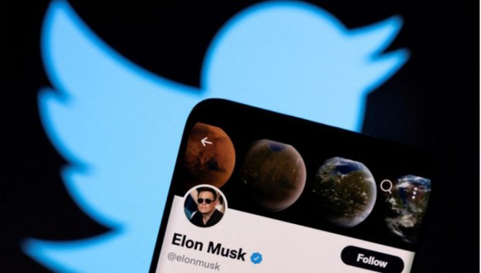 Elon-Musks-twitter-account_Reuters-746x424 Elon Musk's twitter account is seen on a smartphone in front of the Twitter logo in this photo illustration taken, April 15, 2022. REUTERS/Dado Ruvic/Illustration/File Photo