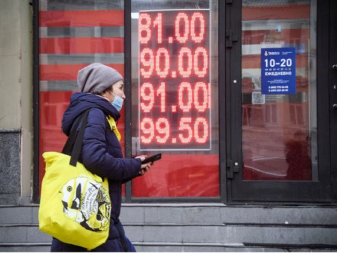 A woman walks past a currency exchange office in central Moscow on Feb. 24. Alexander Nemenov/AFP via Getty Images A woman walks past a currency exchange office in central Moscow on Feb. 24. Alexander Nemenov/AFP via Getty Images