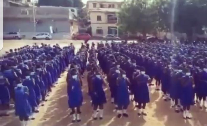 Pupils singing Kelvynboy's Down Flat at assembly