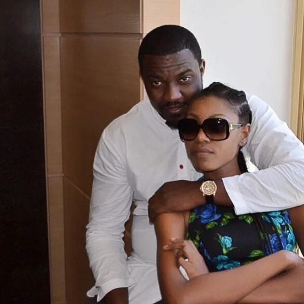 Yvonne Nelson hugging John Dumelo
