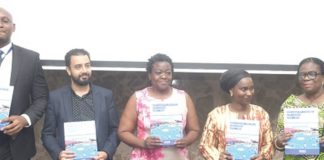 From left: Nnamdi Iwuora, Senior Programme Manager of IOM; David Shokry, Resource Management Officer of IOM; Myra Togobo, Officer in charge of Data Management, Evaluation and Registration at the Office of the United Nations Resident Coordinator; Abibatou Wane, the IOM’s Chief of Mission for Ghana, Benin and Togo, and Adelaide Anno-Kumi, Chief Director of the Ministry of the Interior, diplaying the IOM Ghana Country Strategy for 2022 to 2025 at the launch in Accra