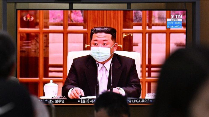 North Korean leader Kim Jong Un appeared in a face mask on television for the first time on Thursday to order nationwide lockdowns GETTY IMAGES