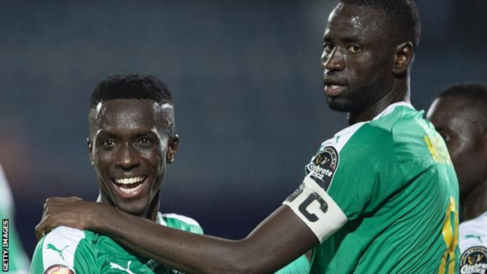 Kouyate (right) and Gueye were both part of the Senegal side that won the country's first African Cup of Nations title in February GETTY IMAGES