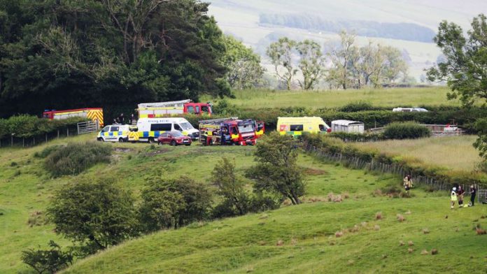 Emergency services by Bentham Road near Burton in Lonsdale, where a helicopter has crashed into a field (Image: Ben Lack Photography Ltd) Emergency services by Bentham Road near Burton in Lonsdale, where a helicopter has crashed into a field (Image: Ben Lack Photography Ltd)